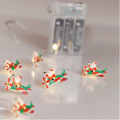 20 mini led Άγιος Βασίλης με αεροπλάνο με θερμό λευκό φως, μπαταρία 3xΑΑ, χρονοδιακόπτη & ασημί χάλκινο καλώδιο  IP20