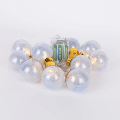 10 led σε σειρά διακοσμητικές μπάλες με ασημί ύφασμα, θερμό λευκό φως, μπαταρία 3xAA, χρονοδιακόπτη & διάφανο pvc καλώδιο IP20