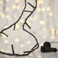 300 led λαμπάκια σε σειρά θερμό λευκό φως 2350K με 4 επεκτάσεις έως 3 σετ, 31v μετασχηματιστή  πράσινο pvc καλώδιο IP44