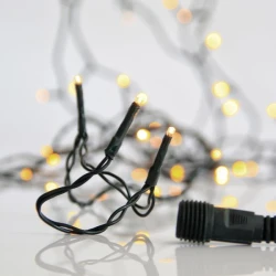 300 led λαμπάκια σε σειρά θερμό λευκό με 4 επεκτάσεις έως 3 σετ, 31v μετασχηματιστή & πράσινο pvc καλώδιο IP44